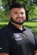 A headshot of Ernesto Duran outdoors.